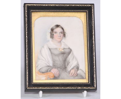 English School, 19th century, a portrait miniature, of a Victorian lady, seated with ringlets in her hair, watercolour on ivo