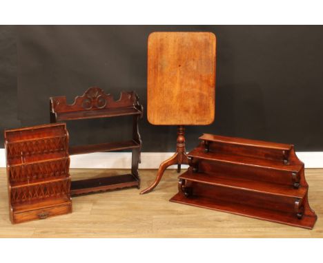 A 19th century mahogany waterfall wall shelf, 42.5cm high, 87cm wide, 19.5cm deep; a 19th century tripod occasional table, 70