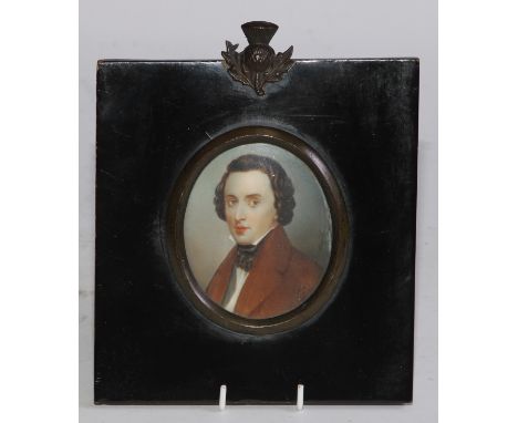 English School, early 19th century, an oval portrait miniature on ivory, young gentleman in brown overcoat and black cravat, 