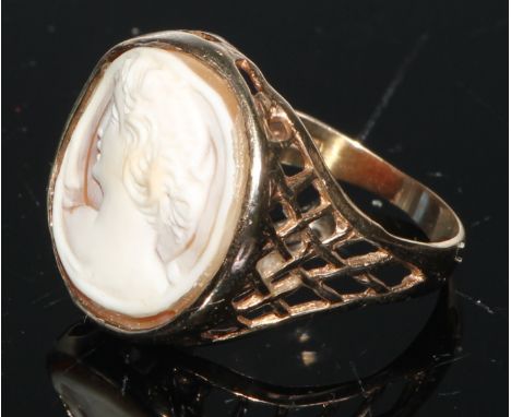 A 9ct gold and shell cameo signet ring, carved with a classical beauty, bezel mount, lattice shank, size R/S; a 9ct gold and 