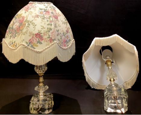 A clear glass side light, 43cm high; a pair of perpex side lights; a metal side light; a five light candle lustre