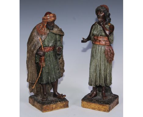 A pair of Goldscheider Orientalist terracotta figures, of an Arab lady and gentleman, , 38.5cm high, impressed marks, c.1910 