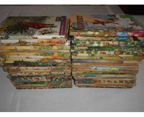 RUPERT ANNUALS   44 annuals from late 1950's - late   1970's, Magic Paintings done, some lack spines, some   duplicates      