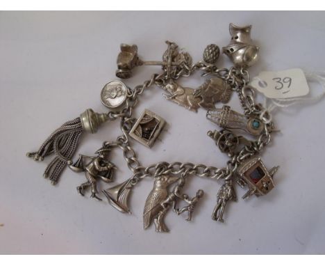 Silver charm bracelet set with oodles of interesting   silver charms 52g       