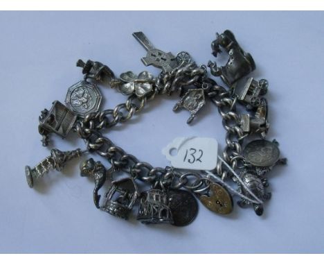 Heavy silver charm bracelet set with numerous   charms 90g        