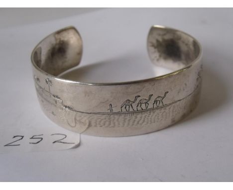 An Egyptian silver bangle 35g     
