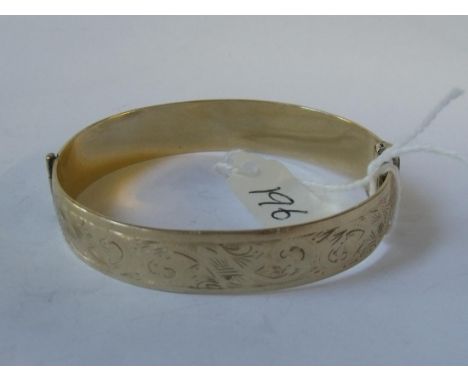 Rolled gold scroll engraved bangle     