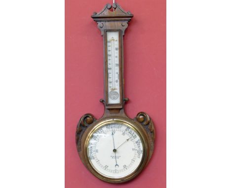 An Edwardian oak aneroid barometer (Partridge, Reading) Conditions reports are not available for our Interiors Sale.
