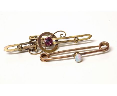 Two Victorian 9ct gold brooches, one set with garnet and seed pearl, the other with small opal. Conditions reports are not av