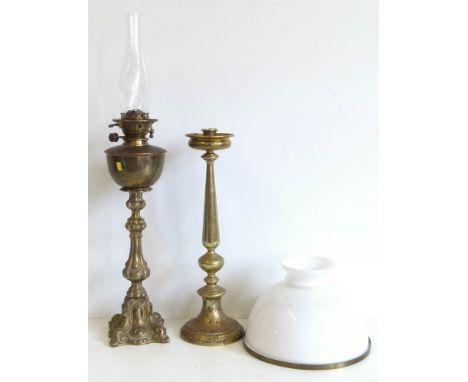 Victorian brass oil lamp with a shade and a candle stick Conditions reports are not available for our Interiors Sale.