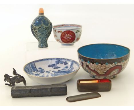 A collection of Chinese and Japanese items to include a tea bowl, seal, saucers, snuff box, small bronze, cloisonné bowl etc 