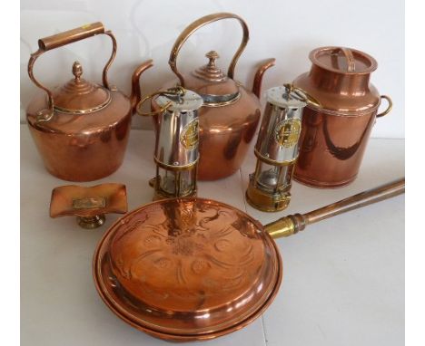 Two copper kettles, a copper gallon churn, copper bed warming pan and two miners lamps ( Protector Lamp & Lighting Co.) etc. 