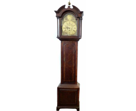 An 18th century mahogany longcase clock by William Musgrave of Leeds. With broken arched pediment and orb finial and long cro