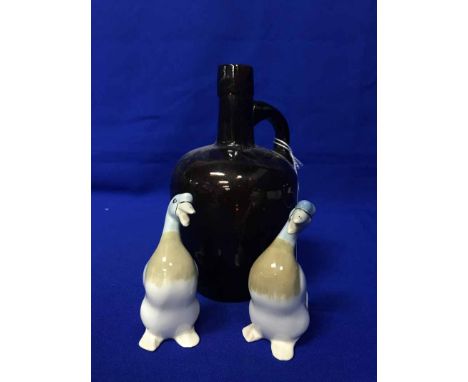 BROWN GLASS SPIRIT FLASK AND A PAIR OF BURSLEM DUCK FIGURES