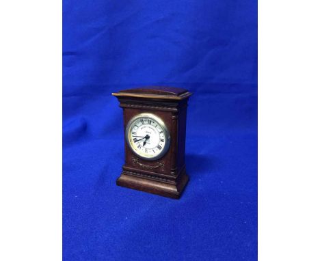 WALNUT CASED MANTEL CLOCK AND A BAROMETER