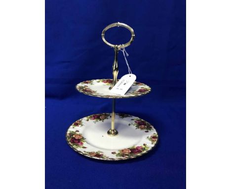 ROYAL ALBERT 'COUNTRY ROSES' TEA SERVICEcomprising a teapot, three cups, three saucers, milk, sugar, butter dish and a two ti