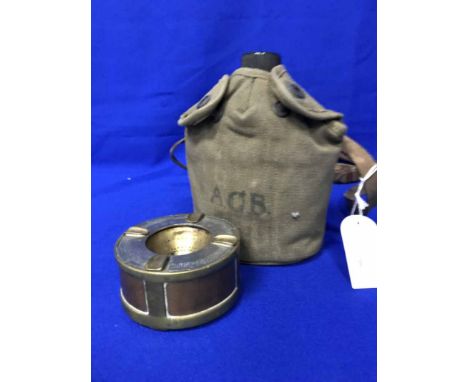 TRENCH ART ASHTRAY AND AN EARLY 20TH CENTURY MILITARY FLASK