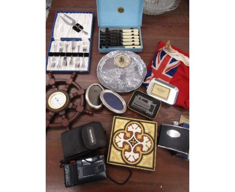 Collectables to include British Ensign flag, ships wheel clock, matchbox holder, Olympus trip camera, hip flask etc