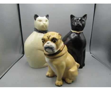 Two ceramic cats and one pug biscuit caddy&nbsp;