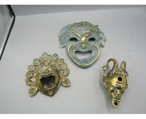 Vintage brass wall masks and brass devil oil lamp