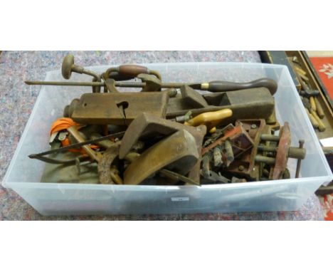 A box of tools including shoe last, wooden planes, braces, bench vices etc.