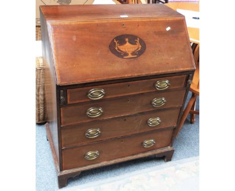 An Edwardian cross-banded and inlaid mahogany bureau with fitted interior, four long graduated drawers and bracket feet, 77cm