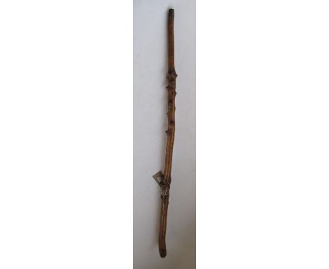 Victorian naïve walking stick, handle carved as a male face with glass eyes, all over penwork decorated with Military figures