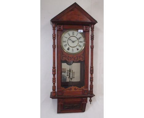 Early C20th American Vienna style walnut cased wall clock, architectural pediment over glazed panelled door with fluted decor