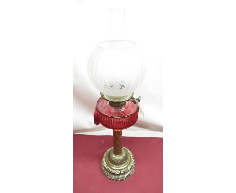 Late C19th oil lamp with frosted and etched shade, cylindrical cranberry faceted reservoir on rope twist column on circular m
