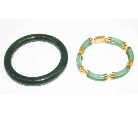 Chinese style yellow metal and Jade bracelet with dragon detail closure, L18cm, and a spinach-green jade bangle, D6cm (2) 
