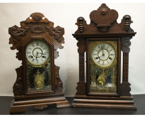 Two late C19th New Haven Clock Co. mahogany cased shelf clocks, with carved cases, cream dials with Roman numerals and outer 