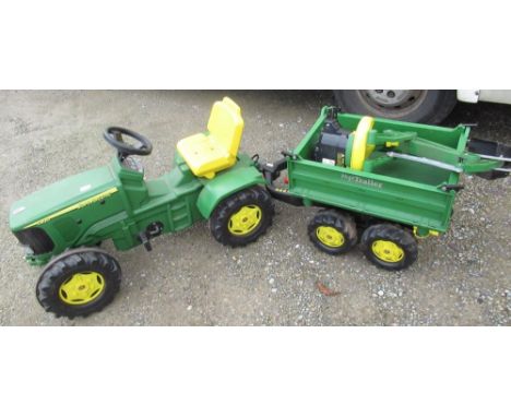 A child's pedal John Deere tractor, trailer and back hoe