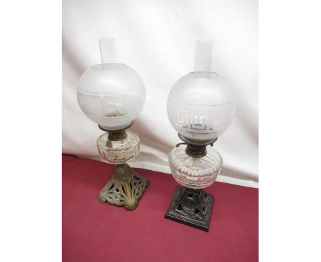 Late C19th oil lamp with clear and frosted glass shade with Greek key decoration, clear faceted glass reservoir on cast metal