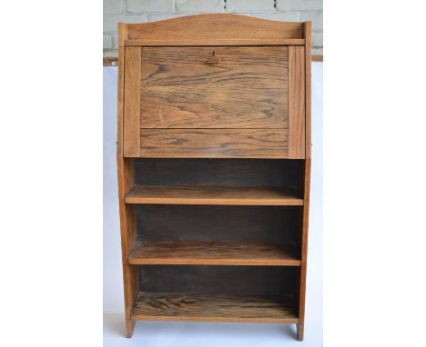 A tall but shallow floor standing desk with hinged top panel, writing area with letter and stationary racks and 3 shelves. No