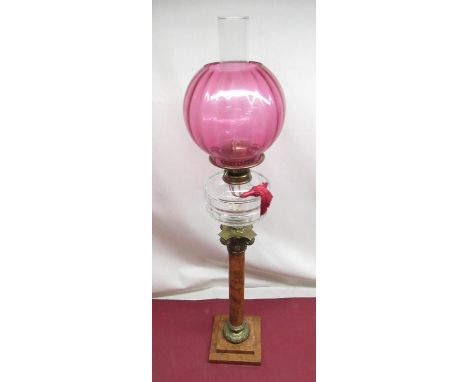 Late C19th oil lamp, cranberry coloured shade, faceted clear glass reservoir on sienna marble corinthian column with brass ca