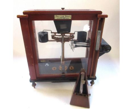 Set of C20th L.Obertling Release-o-matic Balance scales in mahogany case, W43cm D24cm H50cm and a metronome, (2) 