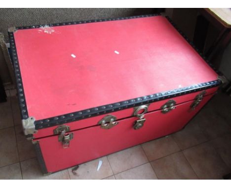 Large red trunk containing various clothing incl. Hunting jacket with gilt buttons, Devlin &amp; Co. blue cape with Excelsior