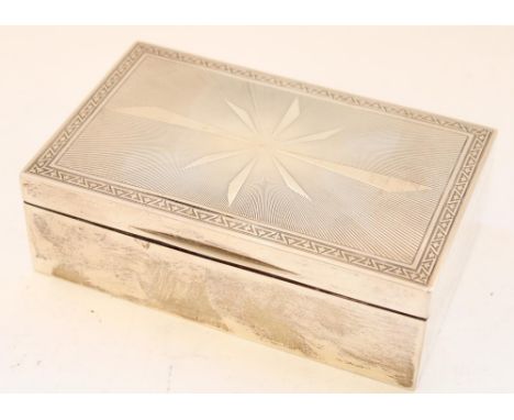 Geo.V hallmarked silver cigarette box, with engine turned starburst decoration to front with symmetrical fleur-de-lys border 