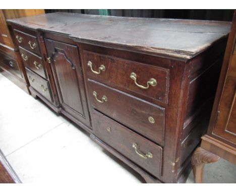 Geo.III inverted breakfront oak dresser, central cupboard enclosed by six drawers, on bracket feet, later three-tier rack, W1