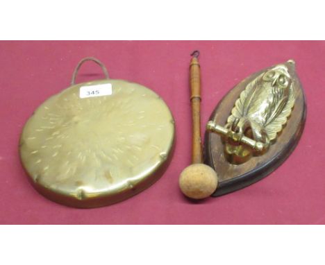 Early C20th wall mounted dinner gong, on cast owl on scroll branch bracket and oak lozenge shaped plaque, with embossed and b