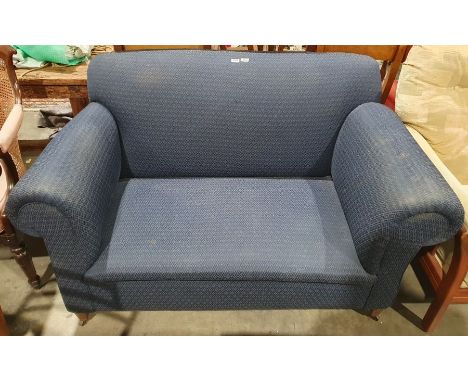 Early 20th century 2 seater sofa in blue trellis weave on tapering supports and castors.