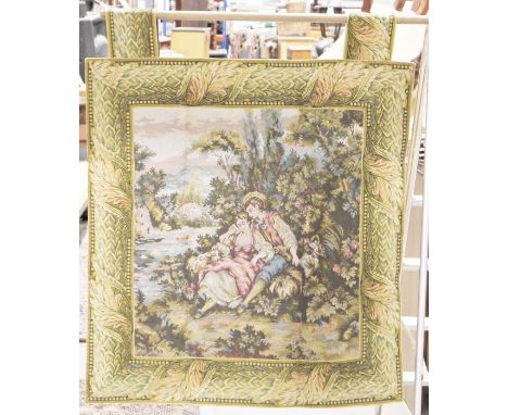 Wall hanging French machine tapestry, the central panel with pair of lovers beside a river, with floral border. 91cm x 85cm