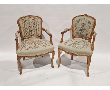 Pair of reproduction French-style open arm elbow chairs with tapestry woolwork upholstered pad backs and seats, on cabriole s