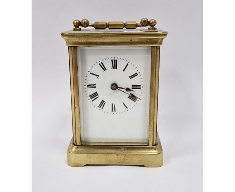 Gilt brass carriage clock&nbsp;in corniche case, having white enamel dial, Roman numerals, 15cm high over the handle&nbsp;