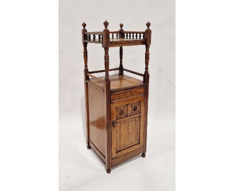 Edwardian oak cabinet&nbsp;having a galleried top shelf with turned finials, over turned supports, open shelf, the cupboard b