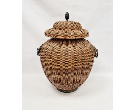 Covered basket, the cover with pointed metal finial and having iron ring handles, 67cm high overall&nbsp;