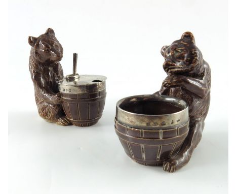 A pair of Doulton Lambeth stoneware novelty condiments, circa 1898, in the form of bears, including  a mustard pot and salt c