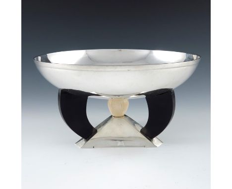 An Art Deco silver centrepiece bowl, American circa 1925, the triangular section pyramidal base with three ebonised arms and 