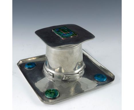 Archibald Knox for Liberty and Co., an Arts and Crafts Tudric pewter and enamelled inkwell, model 0141, the square section tr