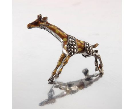 A silver marcasite and enamelled brooch, in the form of a giraffe, circa 1940, stamped sterling, 5cm long